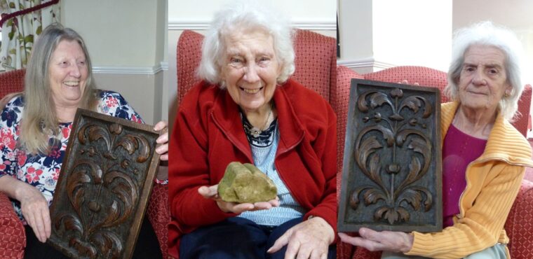 residents holding medieval Rotherham artefacts