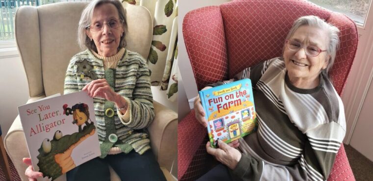 home residents holding books on World Book Day